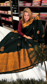 Desuetude Dark Green Soft Banarasi Silk Saree With Gorgeous Blouse Piece