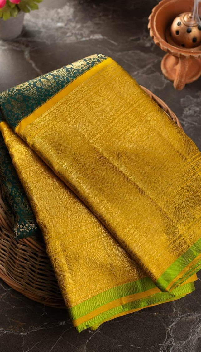 Valiba Kanchipuram silk saree has brocade of gold zari flower pots With edge and rich brocade Saree