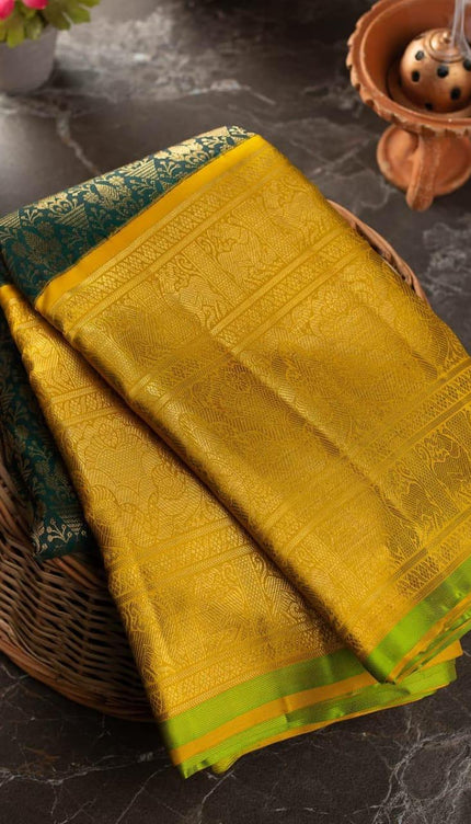 Valiba Kanchipuram silk saree has brocade of gold zari flower pots With edge and rich brocade Saree