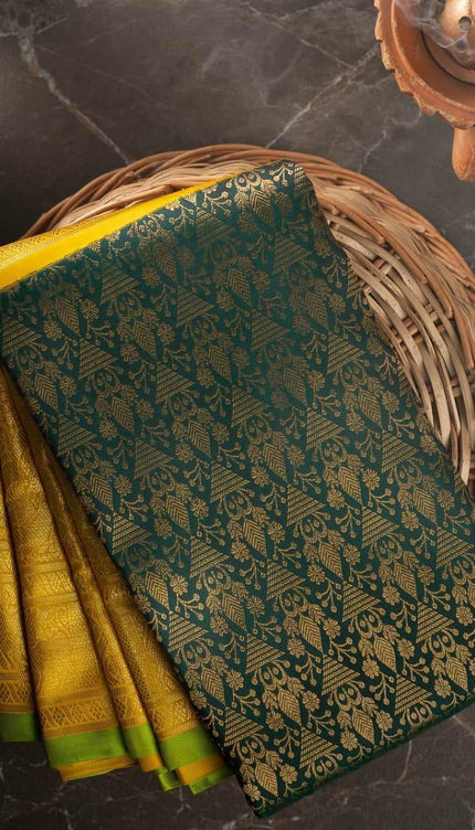 Valiba Kanchipuram silk saree has brocade of gold zari flower pots With edge and rich brocade Saree