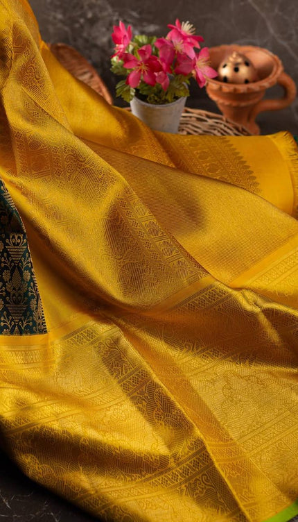 Valiba Kanchipuram silk saree has brocade of gold zari flower pots With edge and rich brocade Saree