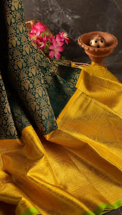 Valiba Kanchipuram silk saree has brocade of gold zari flower pots With edge and rich brocade Saree