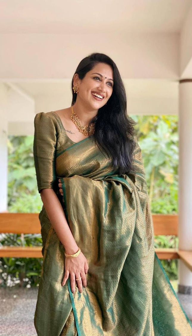 Mitera Green Woven Designer Party Wear Soft Silk  Lichi Silk Saree .
